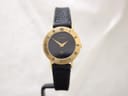 Gucci 3000L gold plated watch, front view showing black Roman numeral dial.