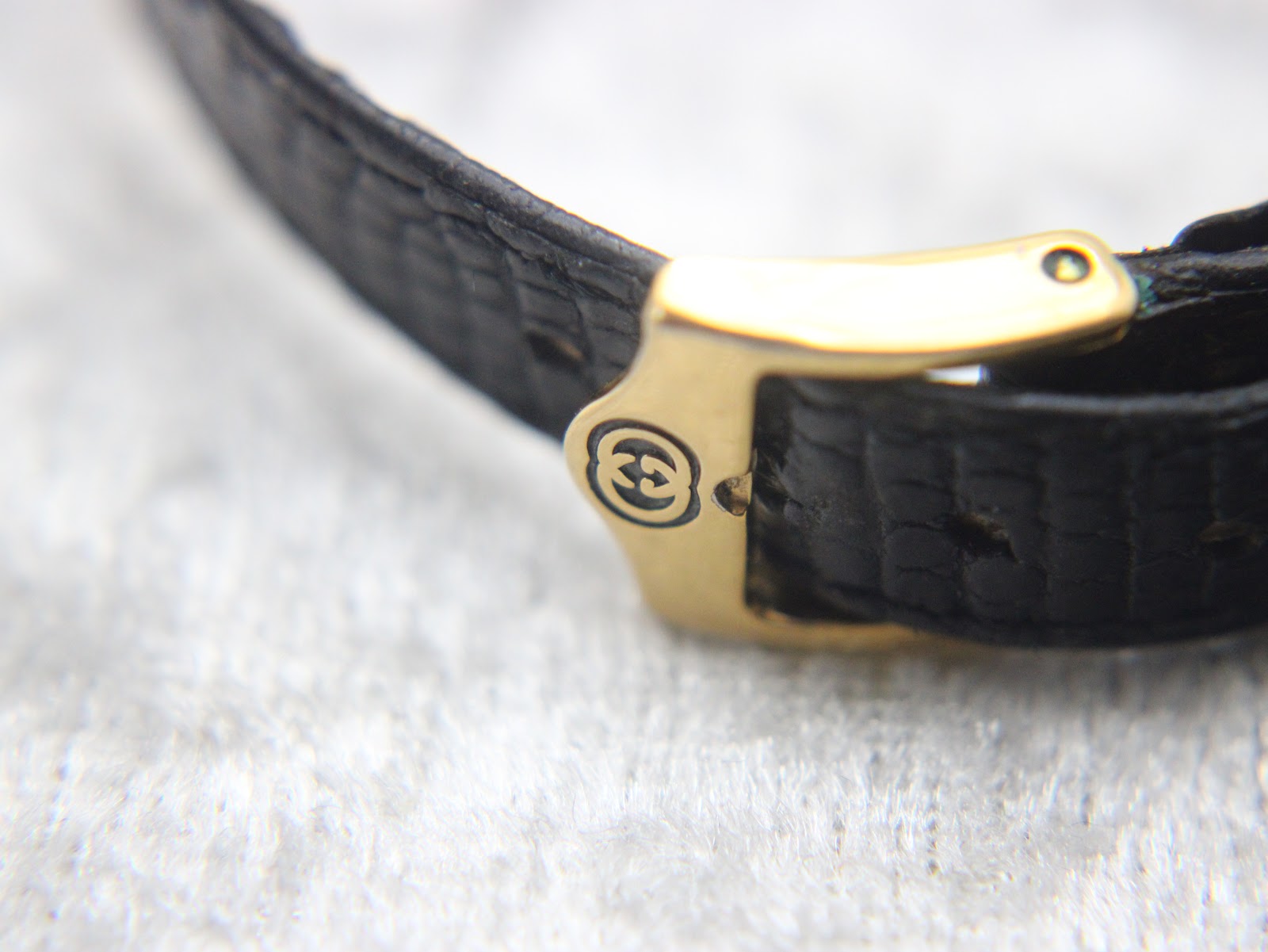 Overhead shot of the Gucci 3000L watch, highlighting the leather strap texture.