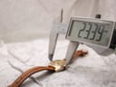 Digital caliper measuring the case diameter of the Bulova watch, displaying 23.39mm.