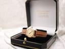 Bulova watch displayed in an open black jewellery box with a white interior, showing the dial and brown leather strap.