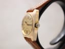 Side view of the Bulova watch, highlighting the gold-plated case and signed Bulova crown.