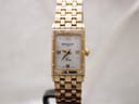 Front view of gold-tone Raymond Weil Tango watch with white mother-of-pearl dial and Roman numerals.
