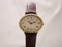 Front view of Raymond Weil Genève 683 watch on a brown leather strap, featuring a gold-tone oval case and champagne dial with Roman numerals.