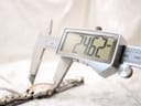 Digital caliper measuring the case diameter of the Tissot PR 50 watch, displaying 24.62mm.