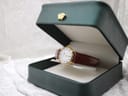 Angled view of the Raymond Weil 9923 watch nestled in a dark green presentation box, showcasing its elegance.
