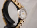 Angled side view of Raymond Weil watch, highlighting the polished bezel and two-tone bracelet