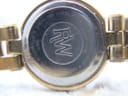 Close-up of the stainless steel case back, showing 'Raymond Weil' and '5817' engravings