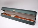 The Raymond Weil 9155 watch with its brown leather strap presented inside a dark green display box.