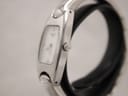 Side view of the Tissot bangle watch showing the polished stainless steel case and original crown.