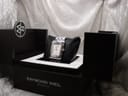 Raymond Weil Tango watch displayed in its original black presentation box with an 'RW' logo detail.