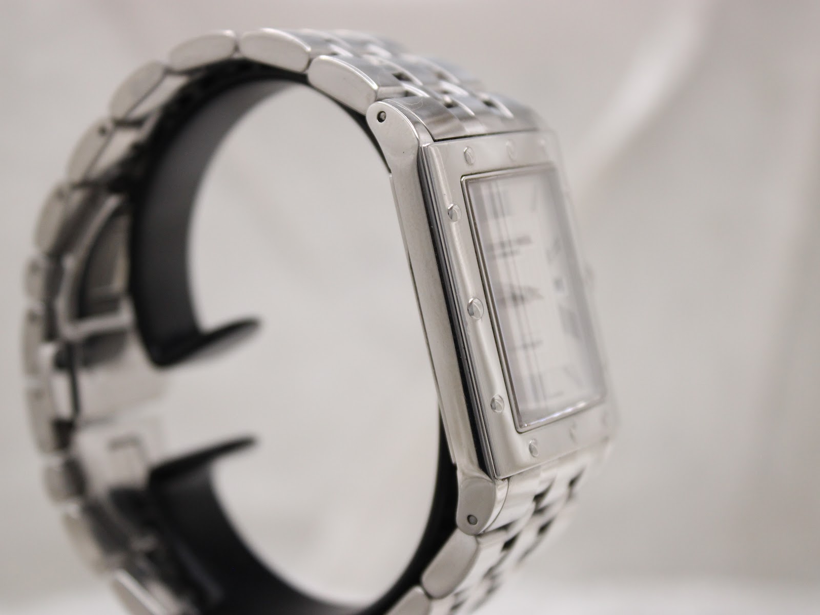 Left side profile of the Raymond Weil Tango watch, highlighting the rectangular case design and bracelet links.