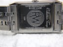 Close-up of the watch case back engraved with 'WATER RESISTANT 5ATM', 'SWISS MADE', 'SAPPHIRE CRYSTAL', 'STAINLESS STEEL', 'Collection Tango', model 5381, and serial K028166.