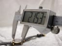 Digital caliper measuring the case diameter of the Gucci 2000L, displaying a precise measurement of 21.53 mm.