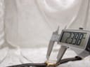 Close-up showing a digital caliper measuring the Raymond Weil 5331 case diameter at 23.98mm.