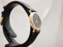 Another side view of the Raymond Weil watch, highlighting the slender case profile and the textured black leather strap.