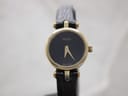 Front view of Gucci 2000L watch, gold plated case, black dial with gold hands, and black lizard-effect leather strap.