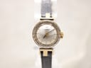 Front view of Tissot 17150 vintage ladies' watch on a display stand, showing the silver sunburst dial and black leather strap.