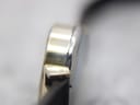 Close-up side view of the gold plated watch case, showing the "20" micron plating mark.