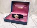 The Tissot 17150 watch resting inside its original blue Tissot presentation box with a pink velvet interior.