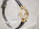 Oblique view of the Tissot watch from the left, showcasing the elegant case profile and the integrated strap design.