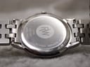 Close-up of the watch case back, showing "RAYMOND WEIL", "STAINLESS STEEL", "WATER RESISTANT 5ATM", "SAPPHIRE CRYSTAL", "SWISS MADE", and model reference 5560.