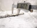 Digital caliper measuring the case diameter of the Raymond Weil Tango, displaying 36.07 mm.