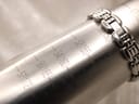 Close-up of the watch bracelet wrapped around a wrist sizing gauge, indicating a maximum wrist circumference of 150mm (15cm).