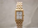 Front view of the Raymond Weil Tango 5971 ladies watch, showing its gold-tone rectangular case, bracelet, and white Roman numeral dial.