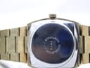 Close-up of the watch's stainless steel case back with 'STAINLESS STEELBACK' and a serial number engraved.