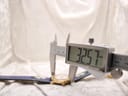 Digital caliper measuring the Michel Jordi Genève watch case diameter at 32.57mm.