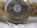 Close-up of the stainless steel case back, showing 'RAYMOND WEIL GENEVE', model '5817', serial number, 'SAPPHIRE CRYSTAL' and 'SWISS MADE' engravings.