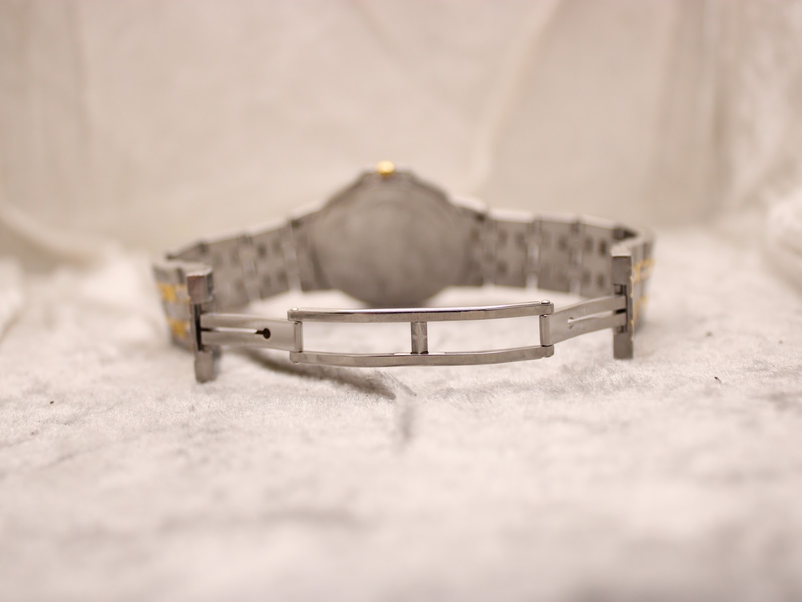 View of the stainless steel folding clasp on the Raymond Weil Tango bracelet, from the underside.