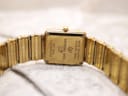 Rear view of the watch case back, showing "Raymond Weil Genève," model "8085," and "18K Gold Electroplated."