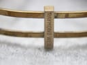 Close-up of the bracelet clasp showing the engraved "RAYMOND WEIL" signature.