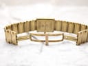 Inner view of the gold-plated bracelet with the signed Raymond Weil fold-over clasp open.