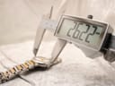 Digital caliper measuring the case diameter of the Movado Concerto, displaying 26.22mm.