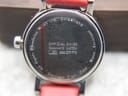 Close-up of the watch case back, with engravings for Mondaine Watch Ltd., Switzerland, Official Swiss Railways Watch, Stainless Steel Case, and Water Resistant.