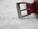 Detail shot of the polished stainless steel pin buckle, clearly engraved with the 'MONDAINE' brand name.