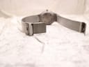 Close-up of the adjustable stainless steel mesh clasp of the Braun BN0211 watch, with the 'BRAUN' logo clearly visible.