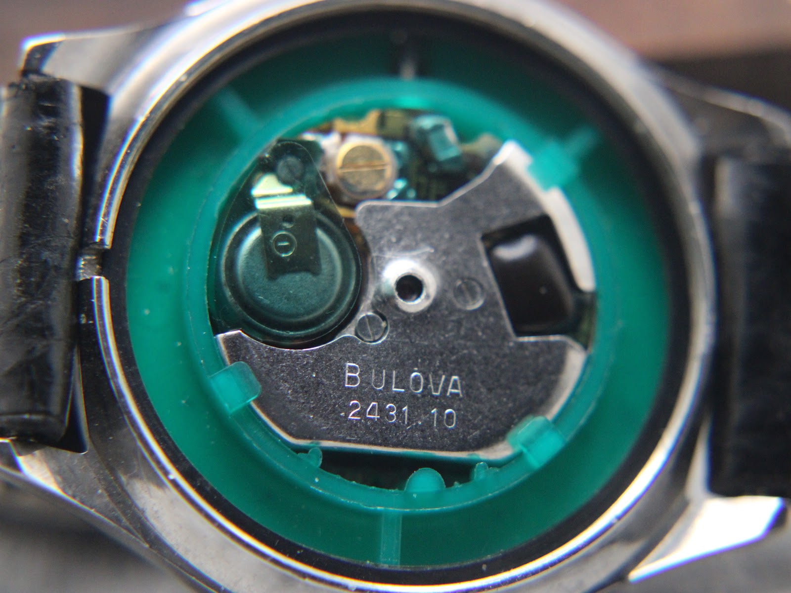 Close-up view of the watch's quartz movement, showing the Bulova calibre 2431.10 inscription.