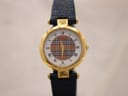 Front view of the Burberrys gold-tone watch with white dial and iconic check pattern.