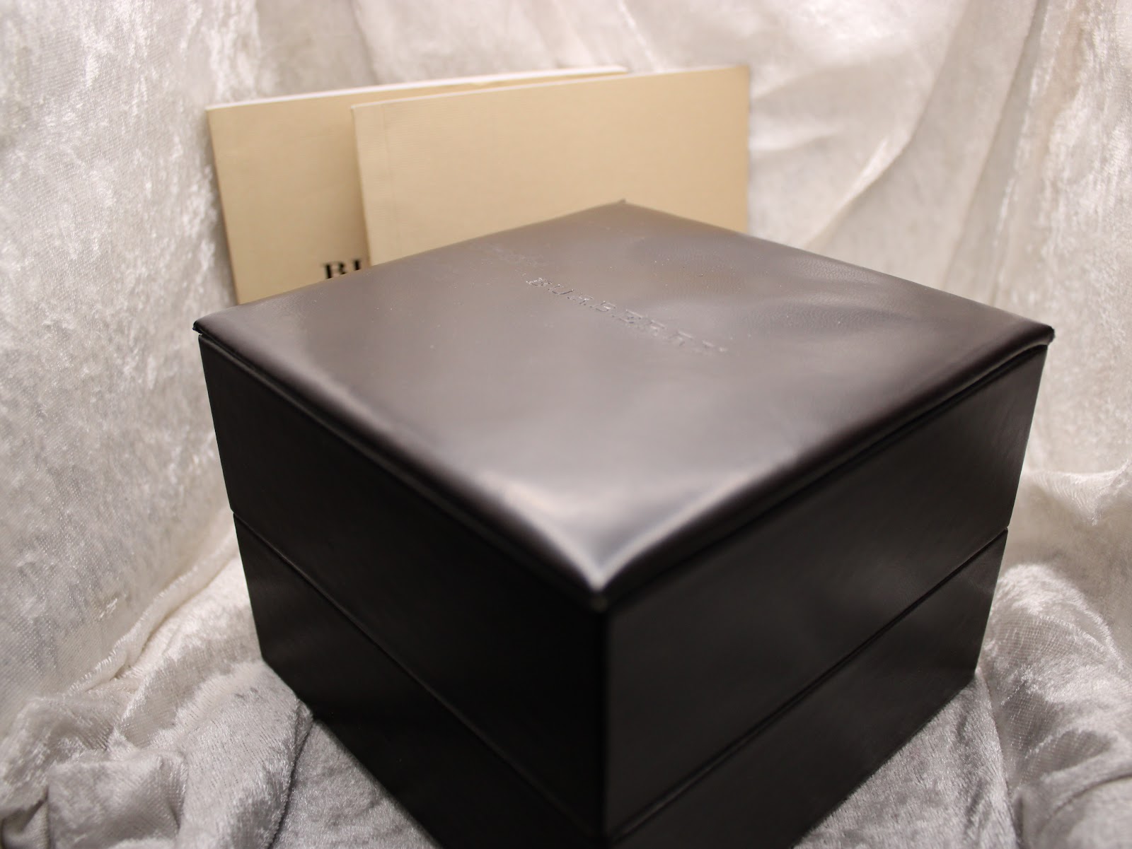 Top view of the closed dark brown Burberrys presentation box.