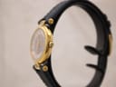 Side view of the Burberrys watch showing the gold-tone case and blue leather strap.