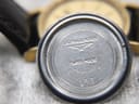 Close-up view of the inside of the watch case back, showing "LONGINES", the winged hourglass logo, "SWISS MADE", and reference numbers "6797 5" and "153".