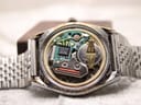 Open case back revealing the Swiss quartz movement, circuit board, and watch battery.