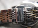 Close-up of the two-tone stainless steel bracelet clasp, clearly showing the 'DREYFUSS & CO.' brand name.