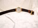 Full back view of the Roamer Canterbury watch, showing the case back and the full length of the light brown leather strap with its gold-tone buckle.