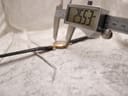 Digital caliper measuring the case diameter of the Rotary watch, displaying a precise measurement of 25.53 mm on the screen.