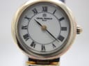 Extreme close-up of the Michel Herbelin white dial with black Roman numerals and 'Michel Herbelin Paris' logo.