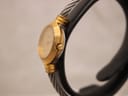 Side view of the Favre-Leuba watch on a stand, highlighting the ribbed gold-tone case, crown, and integrated cable bracelet.